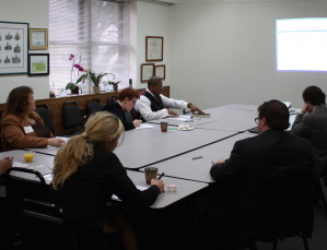 Photo from May 15th presentation on "Twibel and Other Online Defamation" -- attendees sitting around table at presentation.